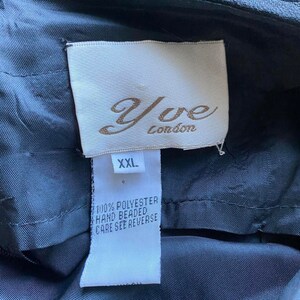 May include: A black label with white text that reads "Yve London" and "XXL". The label also says "100% Polyester Hand Beaded Care See Reverse".