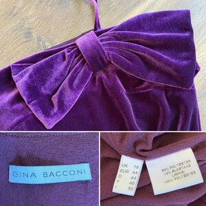 May include: A deep purple velvet dress with a large bow detail on the bodice. The dress has a single shoulder strap and a label that reads "GINA BACCONI". The fabric composition is 90% polyester and 10% elastane.
