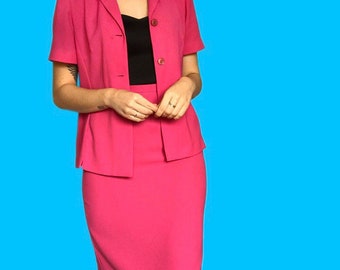 May include: A hot pink short-sleeved blazer and matching skirt suit.