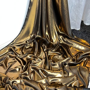 1 meter black/gold soft shimmer on satin fabric 58” wide