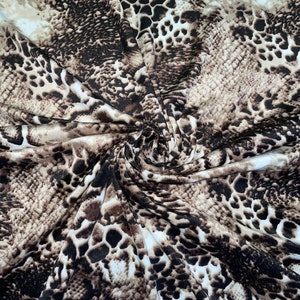 1 meter brown animal snake/leopard print stretch fabric 58” wide