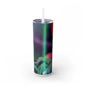 May include: A tall, white tumbler with a colorful design featuring a mountain landscape under a purple and green aurora borealis. The design includes a red planet and a white straw.