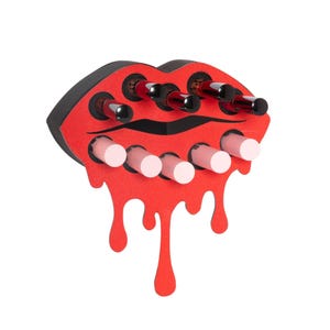 May include: Red and black lip-shaped organizer with 10 slots for holding lipstick or lip gloss tubes. The organizer is made of wood and has a dripping effect.