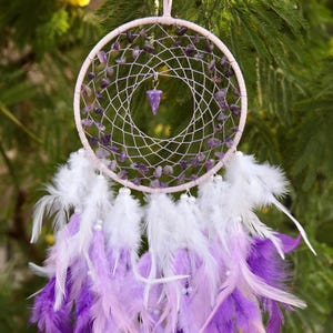 Amethyst chip dreamcatcher hand woven  with  purple, white  and lilac fluffy feathers decorated with beads.
