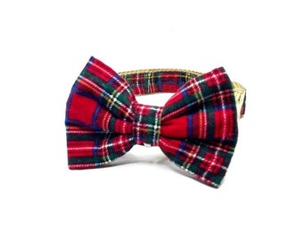May include: Red and green plaid bow tie for a cat or small dog. The bow tie is attached to a gold adjustable collar.