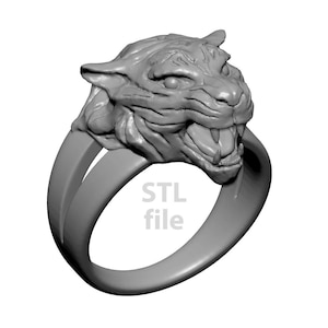 May include: A silver ring with a detailed tiger head design. The ring is made of metal and has a smooth finish. STL file.
