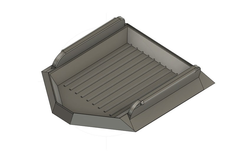 May include: A gray metal construction bucket with a hinged side and a textured bottom. The bucket is designed for lifting and carrying materials.