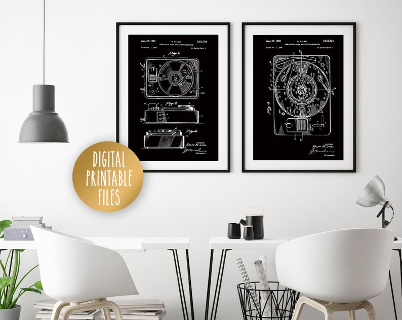 May include: Two black and white vintage patent prints of a record player and a tape recorder. The prints are framed in black frames and are hanging on a white wall. The text on the prints reads "Magnetic Tape Recording Apparatus" and "Magnetic Tape Recording Apparatus".