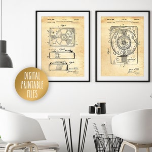 May include: Two vintage black and white patent drawings of record players. The drawings are framed and hung on a white wall. The drawings are on a beige background with black lines.