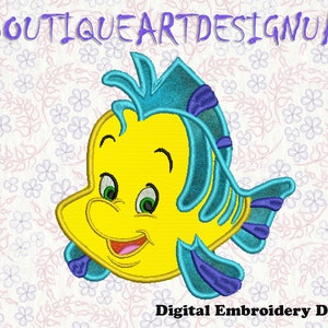 May include: A yellow and blue cartoon fish with a big smile. The fish has a blue fin and tail with purple accents. The fish is on a white background with a floral pattern.