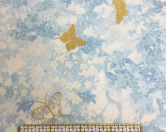 Gold metallic butterflies on blue and white floral background, 100% cotton woven fabric, in stock and ready to ship!