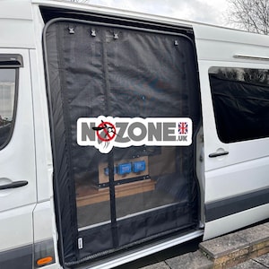 May include: A white van with a black mesh screen door installed on the back. The screen door is labeled with the text "NoZone.uk" and a mosquito icon.