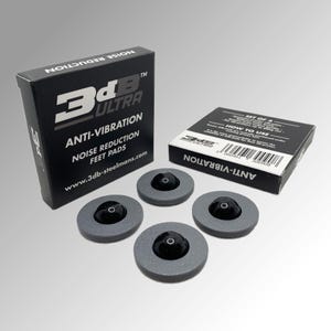 May include: A set of four gray anti-vibration noise reduction feet pads with black rubber tops. The packaging is black with white text that reads "3dB ULTRA Anti-Vibration Noise Reduction Feet Pads www.3db-steelmans.com".
