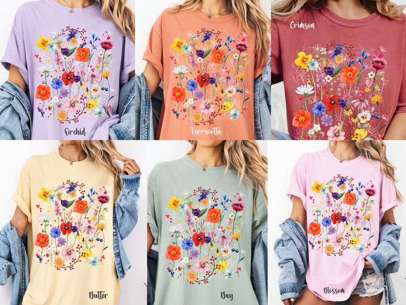 May include: Six different colored t-shirts with a floral print design. The colors are orchid, terracotta, crimson, butter, gray, and blossom.