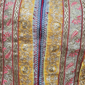 Handmade patchwork cushion cover made with upcycled saree fabric.