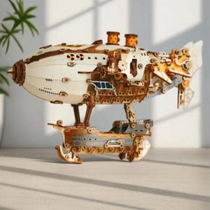 May include: A wooden model of a steampunk airship with intricate details and gears. The airship is white with brown and gold accents. It has a propeller and a rudder. The model is on a wooden base.
