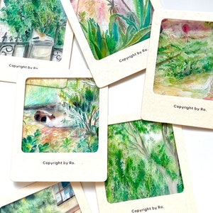 May include: Six watercolor paintings of nature scenes framed in white cardstock with the text "Copyright by Ro." at the bottom of each frame.