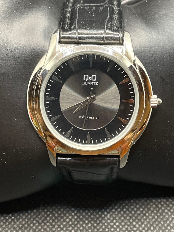 Vintage Q&Q black and silver tone mens watch.