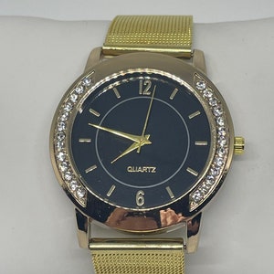 Vintage goldtone black faced rhinestone watch