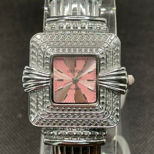 Vintage Geneva silver tone ladies cuff watch.