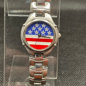 Vintage American Flag ladies silver tone watch.