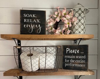 Please remain seated, wood sign