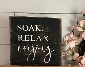 Please remain seated or soak, relax, enjoy wood sign