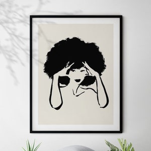 May include: Black and white illustration of a woman with an afro hairstyle. The woman is holding her hair with both hands. The illustration is on a beige background.