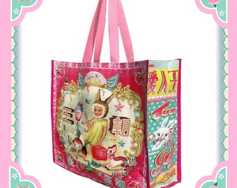 May include: Pink reusable tote bag with a colorful illustration of a girl with bunny ears holding a lantern. The bag has Chinese characters and the text "Joy" on it.