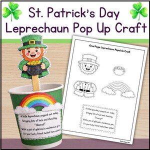 Könnte beinhalten: Ein St. Patrick's Day Bastelset mit einem Leprechaun-Pop-up-Design. Das Set enthält einen grünen Becher mit einem Regenbogen und einem Leprechaun, der einen Goldtopf hält. Auf dem Becher steht: "Ein kleiner Leprechaun ist heute aufgetaucht." Ein Blatt mit Bastellementen ist ebenfalls enthalten.