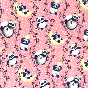 May include: Pink fabric with a repeating pattern of black and white panda bears. The pandas are holding stars, sitting on moons, and holding clocks. The background is covered in small white stars.