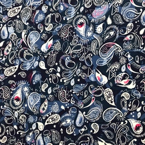 May include: A dark blue background with a white paisley pattern. The pattern includes various shapes, including teardrops, stars, and triangles.
