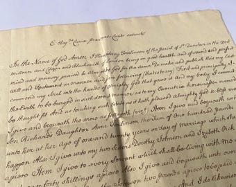 May include: Aged parchment document with handwritten text in dark ink. The document is creased and folded, with visible wear and tear. The script is ornate and appears to be an old legal or personal document.