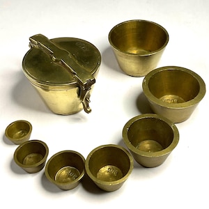 Vintage nesting brass weights.