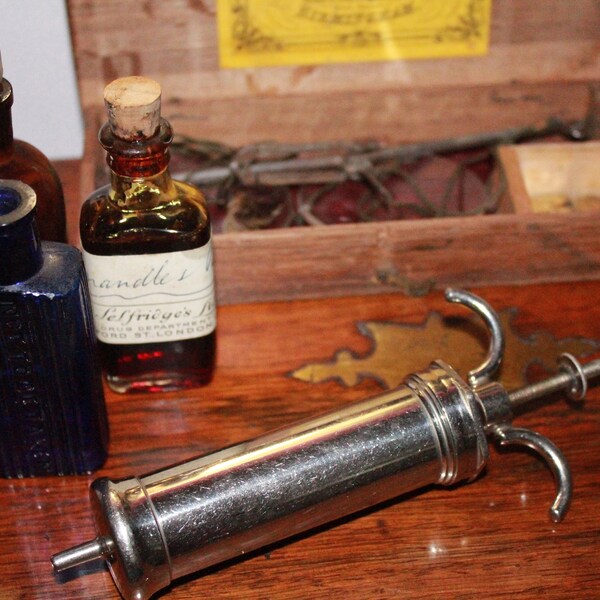 Antique metal syringe. Antique Medical. Antique Surgical.