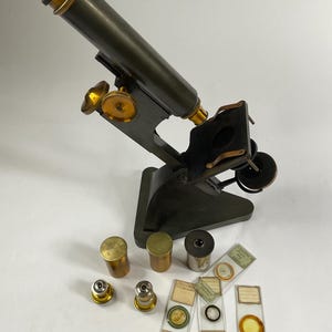 Antique microscope with case, slides and accessory lenses, 1890. Medical scientific.