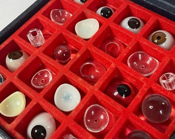 Antique case of glass eyes.