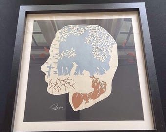 Arte de papel cortado a mano con siluetas