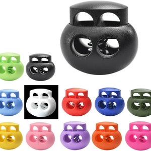 Puede incluir: Surtido de 12 cierres de cordón de palanca en varios colores, incluyendo negro, blanco, verde, azul, rojo, morado, naranja y rosa. Cada cierre de cordón tiene dos agujeros y un mecanismo de resorte.