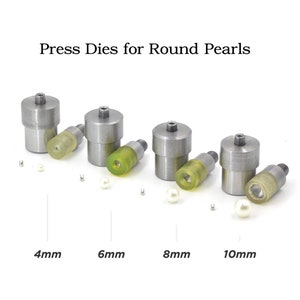 May include: Set of four silver metal press dies for round pearls, with sizes 4mm, 6mm, 8mm, and 10mm. Each die has a small yellow rubber piece on the bottom.