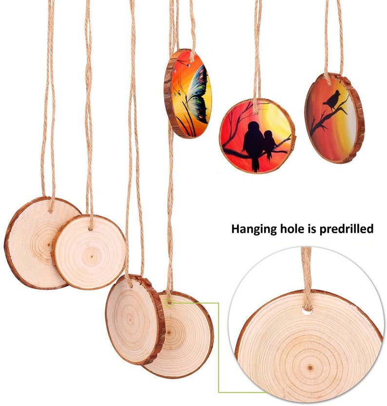 May include: Wooden disc ornaments with natural edges and predrilled hanging holes. Some discs feature painted designs of a butterfly, birds on a branch, and a pair of birds. Each ornament hangs from a natural twine string.