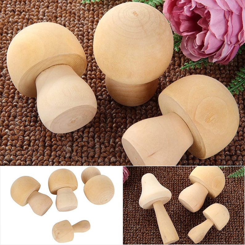 May include: Set of six wooden mushroom figurines in various sizes. The mushrooms are painted in a natural wood color and have a smooth, rounded surface.