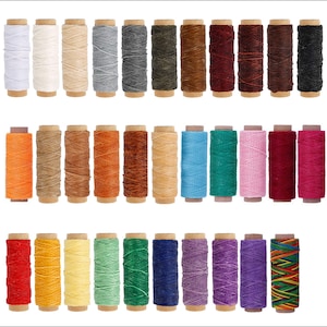 May include: Assortment of 30 spools of waxed thread in various colors, including white, beige, gray, brown, blue, green, red, yellow, orange, purple, and black. The spools are arranged in three rows of ten.
