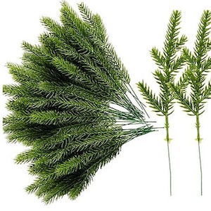 May include: A bunch of artificial green pine sprigs with wire stems. The sprigs are arranged in a fan shape. There are also three individual sprigs with wire stems.