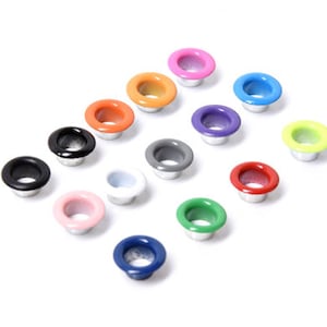 May include: Assortment of colorful metal eyelets in various colors, including black, white, red, green, blue, orange, yellow, pink, and purple.