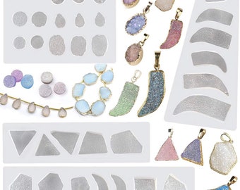 May include: A set of silicone molds for making jewelry featuring various shapes and sizes of agate, druzy, and crystal pendants. The molds are shown with examples of finished pendants in various colors.