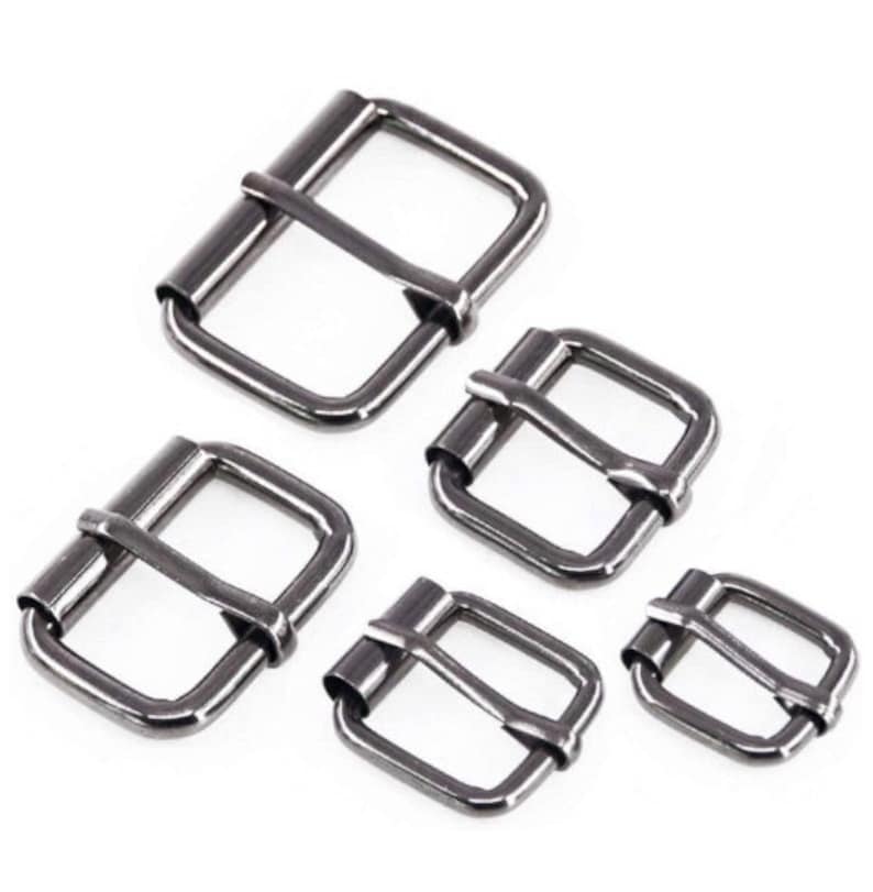 May include: Four black metal belt buckles of different sizes. The buckles are rectangular with a smooth finish.