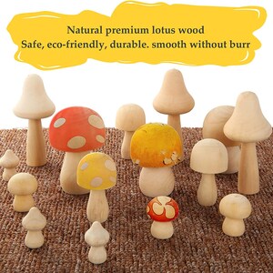 May include: A collection of wooden mushroom figurines in various sizes and colors, including red, yellow, and natural wood. The mushrooms are arranged on a brown woven surface.