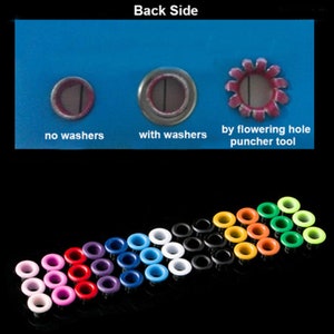 May include: Assortment of colorful metal eyelets, some with washers, arranged in a semi-circle on a black surface. The image also shows three close-up examples of how the eyelets look when installed: "no washers", "with washers", and "by flowering hole puncher tool".