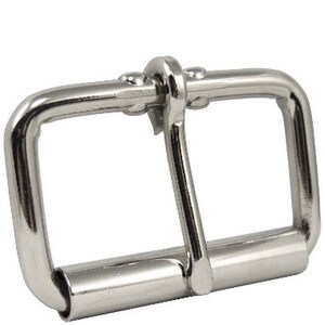 May include: Silver metal buckle with a single prong. The buckle is designed for a belt or strap.
